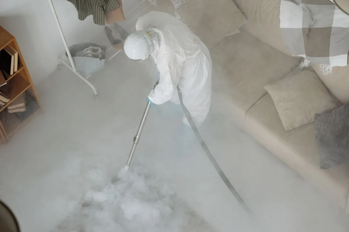 Biohazard cleanup technician in protective equipment, Ferndale, PA